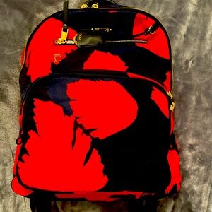 mint, almost new tumi womens backpack in black and orange